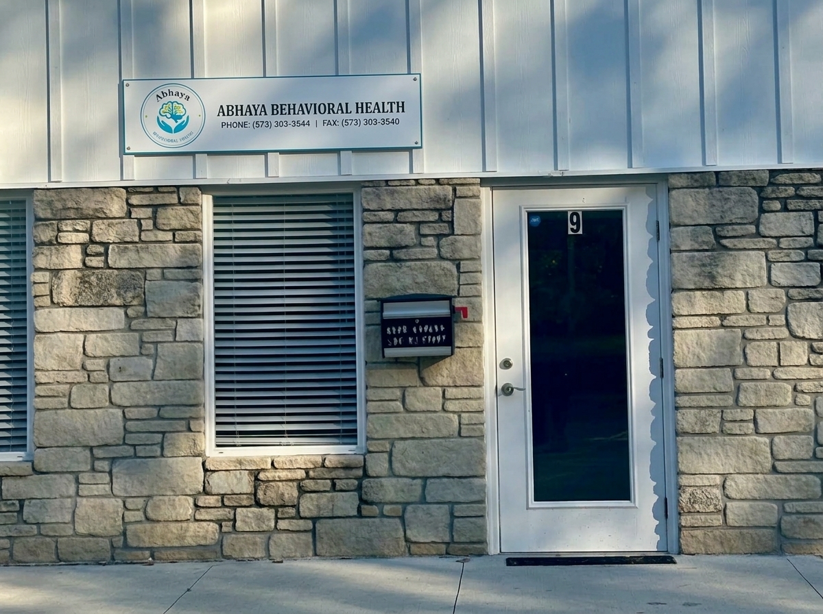 Main entrance to Abhaya Behavioral Health, Suite 9, with the new clinic signboard