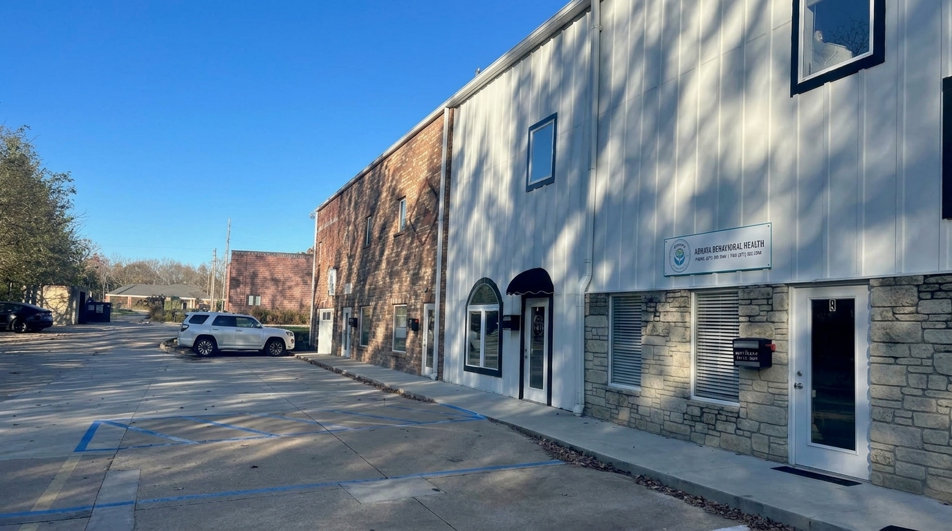 Exterior of Abhaya Behavioral Health with the new clinic signboard and parking area